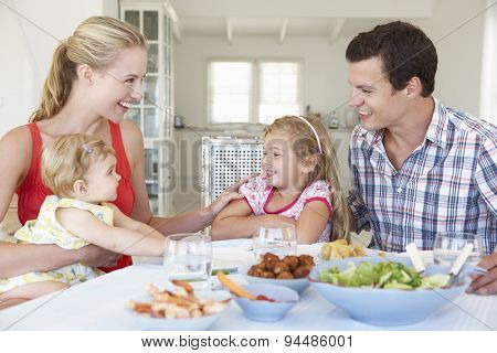 Family Enjoying Meal Together At Home