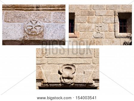 Detail of three stone carved symbols on the external walls of the Church of St Mary of Visitation (Santa Maria da Visitacao) in the village of Castro Laboreiro Northern Portugal