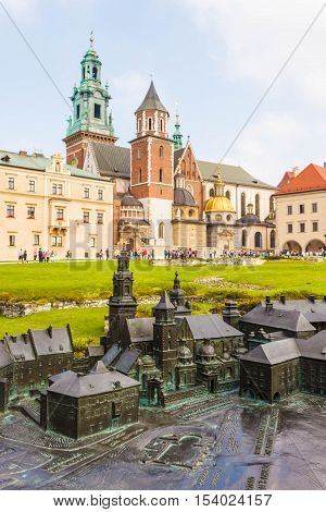 Krakow Poland - September 7 2016: A model of Wawel castle with the original Royal Archcathedral Basilica of Saints Stanislaus and Wenceslaus and other building of the castle on the background.