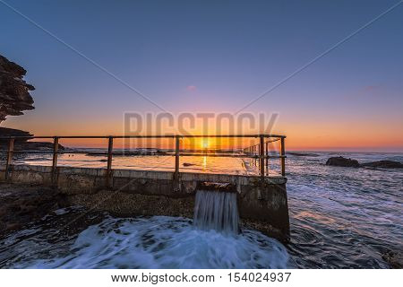 Sunrise on the Rock pool at North Curl Curl Beach, Sydney, Australia