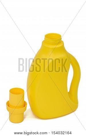 Yellow plastic bottle with a dispenser in cap isolated on white background. Detergent for ware and cleaning in kitchen.