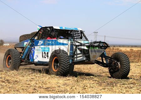 Forty Five Degree Close-up View Of Speeding White Aceco Rally Car