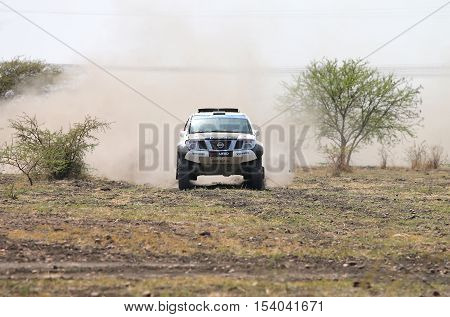 Front View Close-up Of Racing Black And White Nissan Navara Rally Car