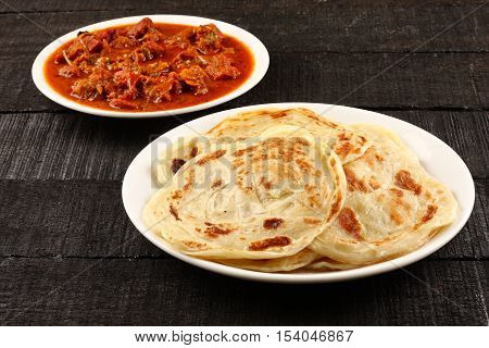 -Paratha with spicy and tasty mutton curry.