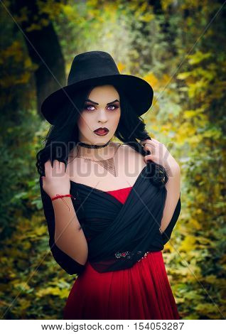 Beautiful girl in the image of the witch