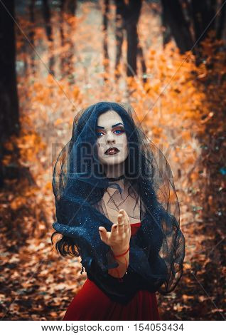 Beautiful girl in the image of the witch