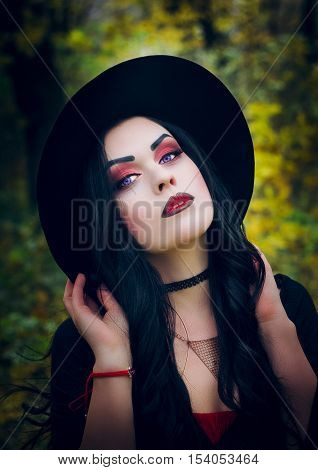 Beautiful girl in the image of the witch