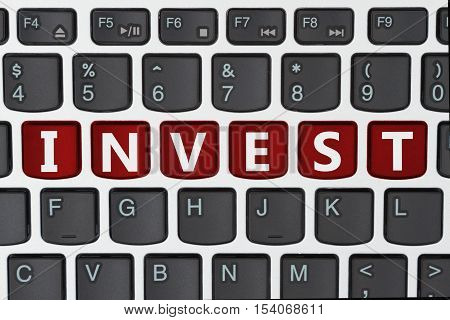 Doing your investing online A close-up of a keyboard with red highlighted text Invest