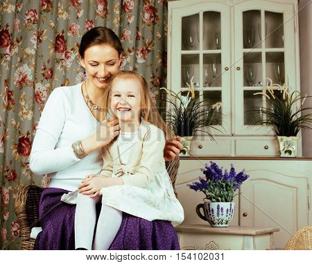 young mother with daughter at luxury home interior vintage, old fashion relashionship family