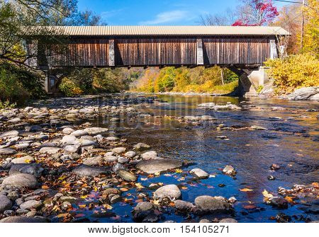 Wooden covered bridge over Willowemoc Creek Catskills Region New York State