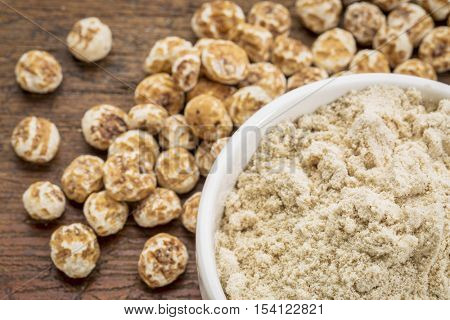 organic tiger nuts, a rich source of resistant starch - peeled nuts and powder for smoothies