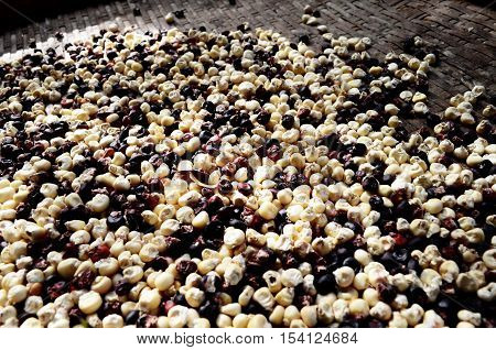 Art purple and white rice seed on a tray brown wood.