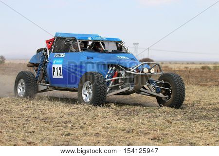 Forty Five Degree Close-up View Of Speeding Blue Zarco Rally Car