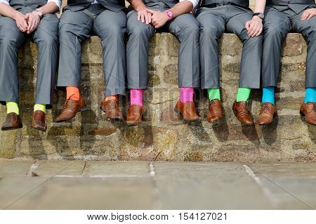 Funny colorful socks of groomsmen on wedding day
