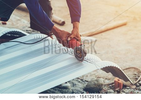 Close Up Hand Man Use Steel Cutting To Roof Metal