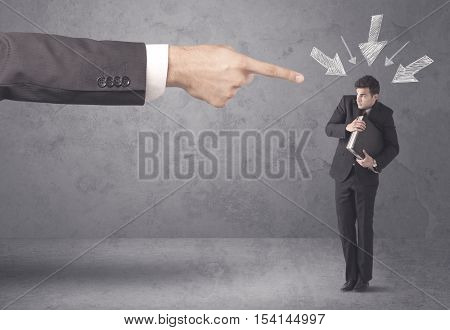 An office boss blaming young amateur and beginner business person with big hand, drawn arrows pointing at him concept
