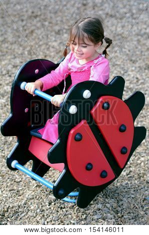 Little Girl Play In Playground