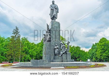 KHARKOV UKRAINE - MAY 20 2016: The great monument to Taras Shevchenko surrounded by the flowerbeds and lush greenery of the city gaden named in his honor  on May 20 in Kharkov.
