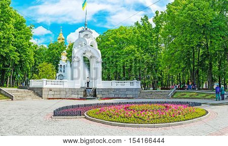 KHARKOV UKRAINE - MAY 20 2016: The colorful flowerbeds Mirror fountain and lush garden in Victory Square the popular place of rest among locals on May 20 in Kharkov.