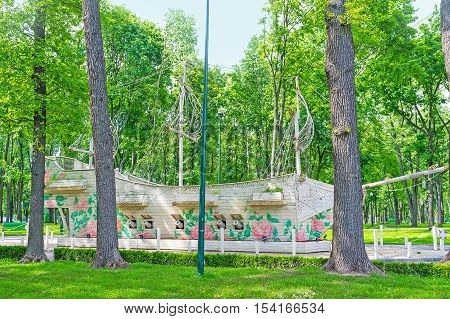 KHARKOV UKRAINE - MAY 20 2016: The wooden white ship among the greenery of Gorky Park of  on May 20 in Kharkov.