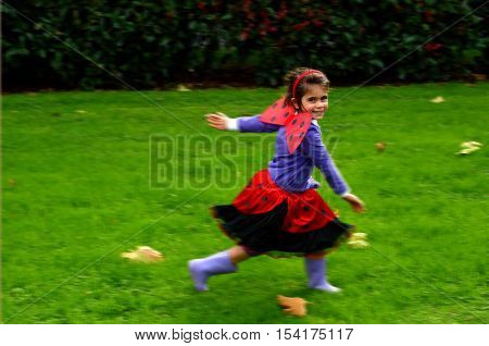 Happy Little Girl Age 05 Dressed Up As Lady Bug