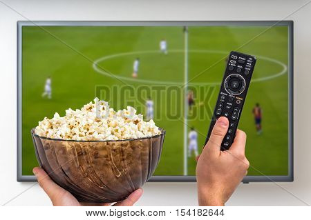 Man Is Watching Football Match On Tv