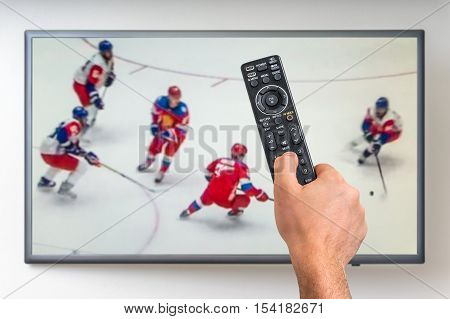 Man Is Watching Hockey Match On Tv