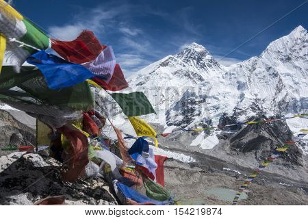 Beautiful Landscape of  Everest and Lhotse peak with colorful Nepali flag as foreground from Kala Pattar view point. Gorak Shep. During the way to Everest base camp. Sagarmatha national park. Nepal.