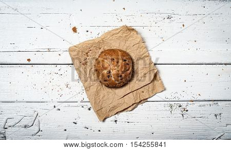 Homemade bun on white retro wooden table
