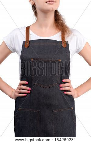 Young redhaired woman chef or waiter posing, wearing apron and white t-shirt isolated on white background