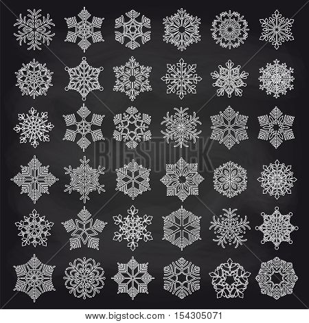 White ounline showflakes set on chalkboard background. Vector illustration
