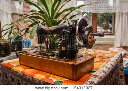 old sewing machine on the table Village House