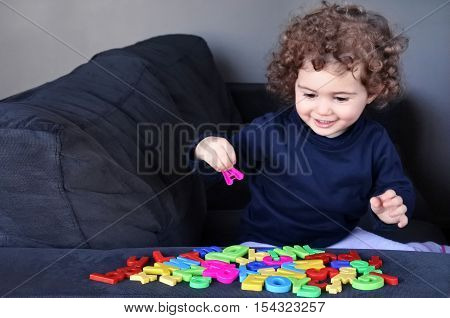 Little Child Learns The English Language Alphabet Letters