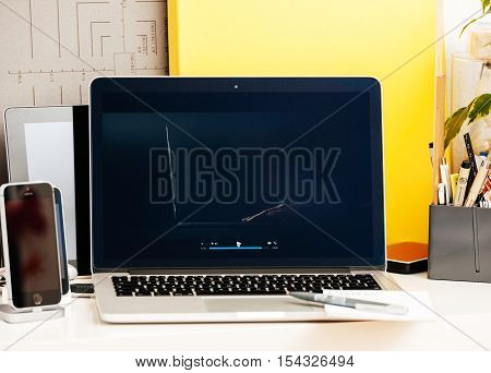 PARIS FRANCE - OCT 28 2016: Apple Computers website on new MacBook Pro Retina with OLED Touch bar in geek creative room showcasing Apple Keynote presentation of Jhony Ive presenting the new laptop film