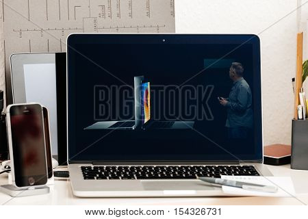 PARIS FRANCE - OCT 28 2016: Apple Computers website on new MacBook Pro Retina with OLED Touch bar in geek creative room showcasing Apple Keynote Comparing Shipping Price Specs of laptops