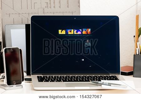 PARIS FRANCE - OCT 28 2016: Apple Computers website on new MacBook Pro Retina with OLED Touch bar in geek creative room showcasing Apple Keynote presentation of laptop range by Philip Schiller