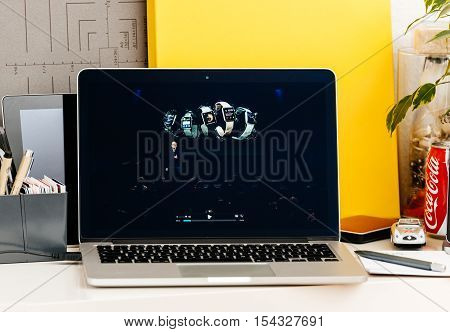 PARIS FRANCE - OCT 28 2016: Apple Computers website on new MacBook Pro Retina with OLED Touch bar in geek creative room showcasing Apple Keynote talking about the succes of Apple Watch