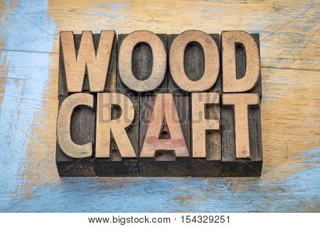 woodcraft - word abstract in vintage letterpress wood type against grunge wood