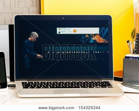 PARIS FRANCE - OCT 28 2016: Apple Computers website on new MacBook Pro Retina with OLED Touch bar in geek creative room showcasing Apple Keynote presentation Craig Federighi talking about new MacBook Pro