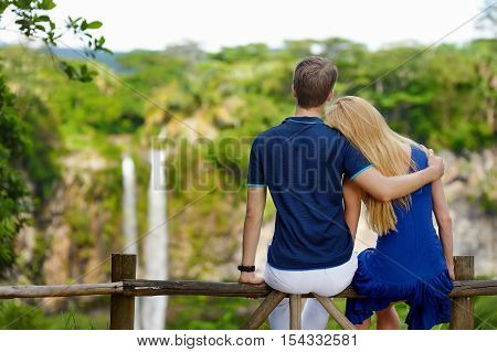 Young Couple Enjoying A View On Chamarel Falls