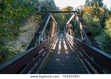 A view of a walking bridge at Tumwater Falls in Washington State.