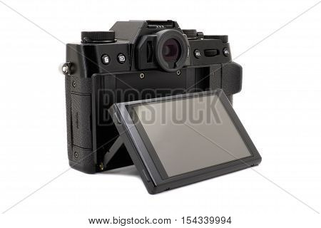 Modern black camera on a white background closeup