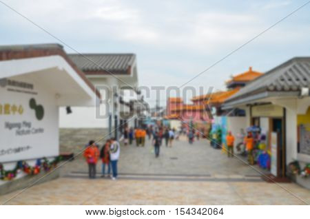 Blurred background Ngong Ping Village .is set on a 1.5 hectare site on Lantau Island adjacent to Ngong Ping Cable Car Terminal and the Tian Tan Buddha Statue.