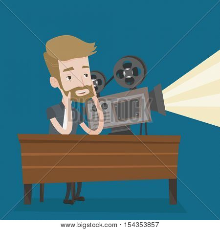 Hipster man with beard sitting near a film projector in the room projectionist. Caucasian projectionist showing new film. Young projectionist at work. Vector flat design illustration. Square layout.