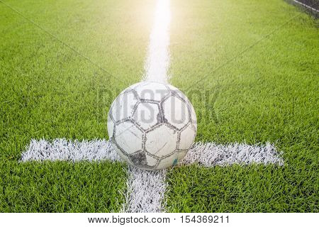 Old Ball  In White With Black Accents On Artificial Turf
