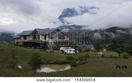 SABAH,BORNEO,Bundu Tuhan, Kundasang-August 29,2016: Cloudy sky scenery of Mount Kinabalu from Hounon Ridge Farmstay