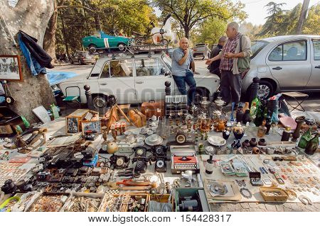 TBILISI, GEORGIA - OCT 9, 2016: Traders of flea market having a lot of vintage cameras souvenirs toys and retro staff for the customers on October 9, 2016. Tbilisi has a population of 1.5 million people