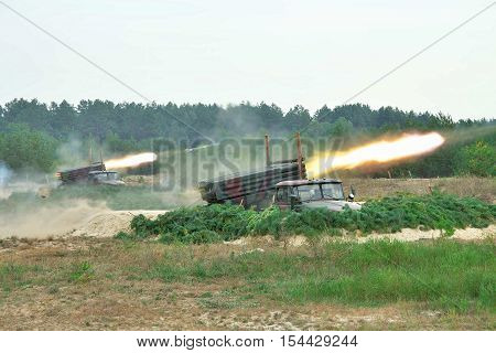 Rocket artillery firing the targets from defiladed position during military training