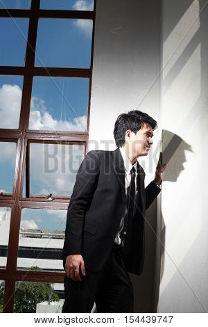 Portrait Of A Smiling Young Handsome Businessman
