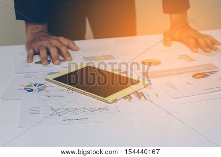 Business People Hands Working With A Tablet On White Table Background. Copy Space. Vintage Tone